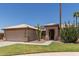Inviting single-story home featuring well-maintained landscaping, tile roof, and a two-car garage at 16288 W Hadley St, Goodyear, AZ 85338