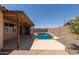 Backyard view with a refreshing blue swimming pool at 16288 W Hadley St, Goodyear, AZ 85338