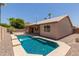Back exterior shot of the house with swimming pool at 16288 W Hadley St, Goodyear, AZ 85338