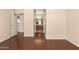 Hardwood-floored room with a view of the bathroom with an extended vanity at 16288 W Hadley St, Goodyear, AZ 85338