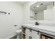 Bathroom features a modern vanity with white countertop, dark hardware, and neutral finishes at 1712 N Old Colony --, Mesa, AZ 85201
