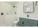 Bathroom featuring a tiled shower, vanity with stylish sink, and elegant mirror at 1712 N Old Colony --, Mesa, AZ 85201