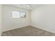 Bedroom with neutral carpet, window, and ceiling fan at 1712 N Old Colony --, Mesa, AZ 85201