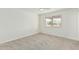 Bedroom with neutral carpet, window, and ceiling fan at 1712 N Old Colony --, Mesa, AZ 85201