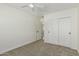 Bedroom features a ceiling fan, carpet, and closet with sliding doors at 1712 N Old Colony --, Mesa, AZ 85201