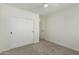 Bedroom with ceiling fan, carpet, and closet with sliding doors at 1712 N Old Colony --, Mesa, AZ 85201