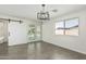 Dining room with sliding glass doors and modern light fixture at 1712 N Old Colony --, Mesa, AZ 85201
