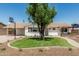 Charming single-story home with a manicured front yard and a large shade tree at 1712 N Old Colony --, Mesa, AZ 85201