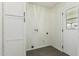 Small laundry room with tile flooring, washer/dryer hookups, and a door at 1712 N Old Colony --, Mesa, AZ 85201