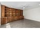 Spacious living room featuring custom built-in shelving and tile flooring at 1712 N Old Colony --, Mesa, AZ 85201
