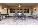 Covered patio with an outdoor dining table set and barbecue at 17812 W Primrose W Ln, Surprise, AZ 85374