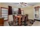 Inviting dining room with a wood table, patterned chairs, and a decorative rug for stylish dining at 17812 W Primrose W Ln, Surprise, AZ 85374