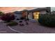 Charming single-story home with desert landscaping, including cacti and flowering bushes, and a tile roof at 17812 W Primrose W Ln, Surprise, AZ 85374