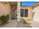 Charming front entrance with desert landscaping and a secure screen door at 17812 W Primrose W Ln, Surprise, AZ 85374