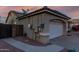 Attached two-car garage with desert landscaping and a charming tile roof at 17812 W Primrose W Ln, Surprise, AZ 85374