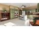 Bright kitchen with painted cabinets, center island with breakfast bar, and modern appliances at 17812 W Primrose W Ln, Surprise, AZ 85374