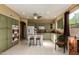 Well-lit kitchen featuring a central island, stainless appliances, and tile flooring at 17812 W Primrose W Ln, Surprise, AZ 85374