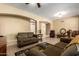 Spacious living room with tile floors, neutral walls, and comfortable seating at 17812 W Primrose W Ln, Surprise, AZ 85374