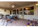 Covered patio with ceiling fan and comfortable seating, ideal for outdoor entertaining at 17812 W Primrose W Ln, Surprise, AZ 85374
