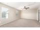 Bedroom with natural light, neutral carpet, and a ceiling fan that enhances comfort at 21182 E Stonecrest Dr, Queen Creek, AZ 85142