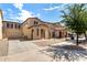 Attractive row of stucco homes featuring covered porches and low maintenance front yards at 21182 E Stonecrest Dr, Queen Creek, AZ 85142