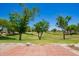 Backyard patio with a view of lush green golf course and blue sky at 215 N Power Rd # 21, Mesa, AZ 85205