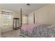 Charming bedroom with four-poster bed, floral accents, and plenty of natural light at 215 N Power Rd # 21, Mesa, AZ 85205