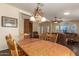 Open dining and living area offers a seamless flow, perfect for entertaining, with modern lighting at 215 N Power Rd # 21, Mesa, AZ 85205