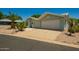 A well maintained house with desert landscaping and a large driveway at 215 N Power Rd # 21, Mesa, AZ 85205