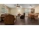 Open floor plan with a dining table and living room with hardwood floors at 215 N Power Rd # 21, Mesa, AZ 85205