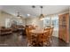 Spacious living room and dining area features stylish furniture, wood floors and plenty of natural light at 215 N Power Rd # 21, Mesa, AZ 85205