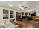 Open-concept floor plan featuring an adjacent kitchen, living and dining area with natural light at 215 N Power Rd # 21, Mesa, AZ 85205