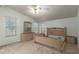 Bright primary bedroom with a neutral color scheme and ample natural light from large windows at 215 N Power Rd # 21, Mesa, AZ 85205