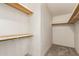 Walk-in closet with built-in shelving for organization and ample storage space at 215 N Power Rd # 21, Mesa, AZ 85205