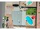 Top-down view of home featuring pool, green lawn, covered patio, and desert landscaping at 2207 W Bentrup St, Chandler, AZ 85224