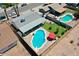 This aerial view shows a sparkling pool, well-maintained yard, and a covered patio in a private backyard at 2207 W Bentrup St, Chandler, AZ 85224