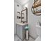 Updated bathroom features a vanity, toilet, marble floors, and a mirror with a golden frame at 2207 W Bentrup St, Chandler, AZ 85224