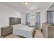 Bedroom features wood floors and updated furniture at 2207 W Bentrup St, Chandler, AZ 85224