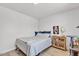 Well-lit bedroom with wood floors, comfortable bed, and a wooden dresser at 2207 W Bentrup St, Chandler, AZ 85224