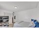 Bedroom features wood floors, closet and white doors at 2207 W Bentrup St, Chandler, AZ 85224