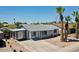 Charming single-story home featuring desert landscaping, a covered carport, and blue and white trim at 2207 W Bentrup St, Chandler, AZ 85224