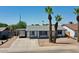 Charming single-story home with palm trees and a long driveway at 2207 W Bentrup St, Chandler, AZ 85224