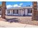 Charming single-story home with a white exterior and blue trim, offering great curb appeal at 2207 W Bentrup St, Chandler, AZ 85224