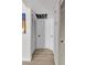 Hallway with wood floors and white doors at 2207 W Bentrup St, Chandler, AZ 85224