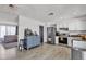 Bright kitchen has stainless appliances, white cabinets, and eat-in bar at 2207 W Bentrup St, Chandler, AZ 85224