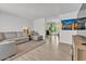 Bright living room features light wood floors and comfortable gray sectional sofa at 2207 W Bentrup St, Chandler, AZ 85224