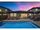 Stunning backyard featuring a refreshing pool, patio area, and well-maintained desert landscaping at 22353 N 99Th Ln, Peoria, AZ 85383