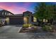 Charming single-Gathering home with well-maintained landscaping, exterior lighting, and a two-car garage at 22353 N 99Th Ln, Peoria, AZ 85383