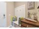 Functional mudroom with built-in bench seating, storage, and wall decor at 22353 N 99Th Ln, Peoria, AZ 85383