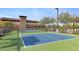 Outdoor pickleball court within a well-maintained community recreational area with shade and seating at 22353 N 99Th Ln, Peoria, AZ 85383